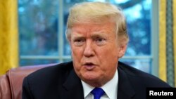 U.S. President Donald Trump sits for an exclusive interview with Reuters journalists in the Oval Office at the White House in Washington, Dec. 11, 2018. 