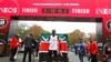 Eliud Kipchoge célèbre son record mondial du marathon à Vienne, Autriche, le 12 octobre 2019.