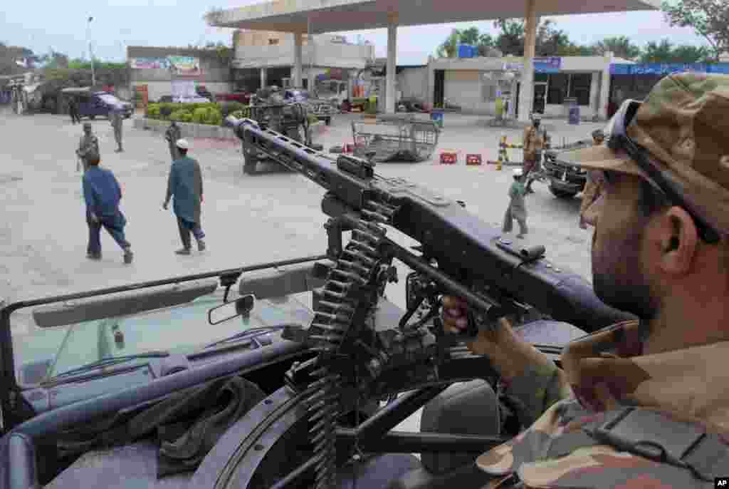 Pakistani army soldiers take positions a day before the nationwide election, in Peshawar. An especially violent spate of killings, kidnappings and bombings has marred the run-up to Pakistan&#39;s nationwide election to be held on Saturday.