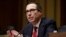 FILE - Steven Mnuchin testifies before his Senate Finance Committee confirmation hearing, Jan. 19, 2017.