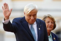 FILE - President of Greece Prokopis Pavlopoulos arrives at Rundale Palace, Latvia, Sept. 13, 2018.