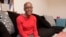 Janice Franklin holds her state-issued ID card as she poses for a photo at her home in Charlotte, N.C., Nov. 19, 2018.