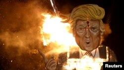 An effigy of U.S. Republican presidential candidate Donald Trump is burned as part of Bonfire Night celebrations in Edenbridge, England, Nov. 5, 2016. 