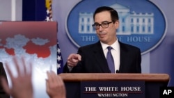 Treasury Secretary Steven Mnuchin calls on a reporter to ask a question during a press briefing at the White House, Jan. 28, 2019, in Washington. 