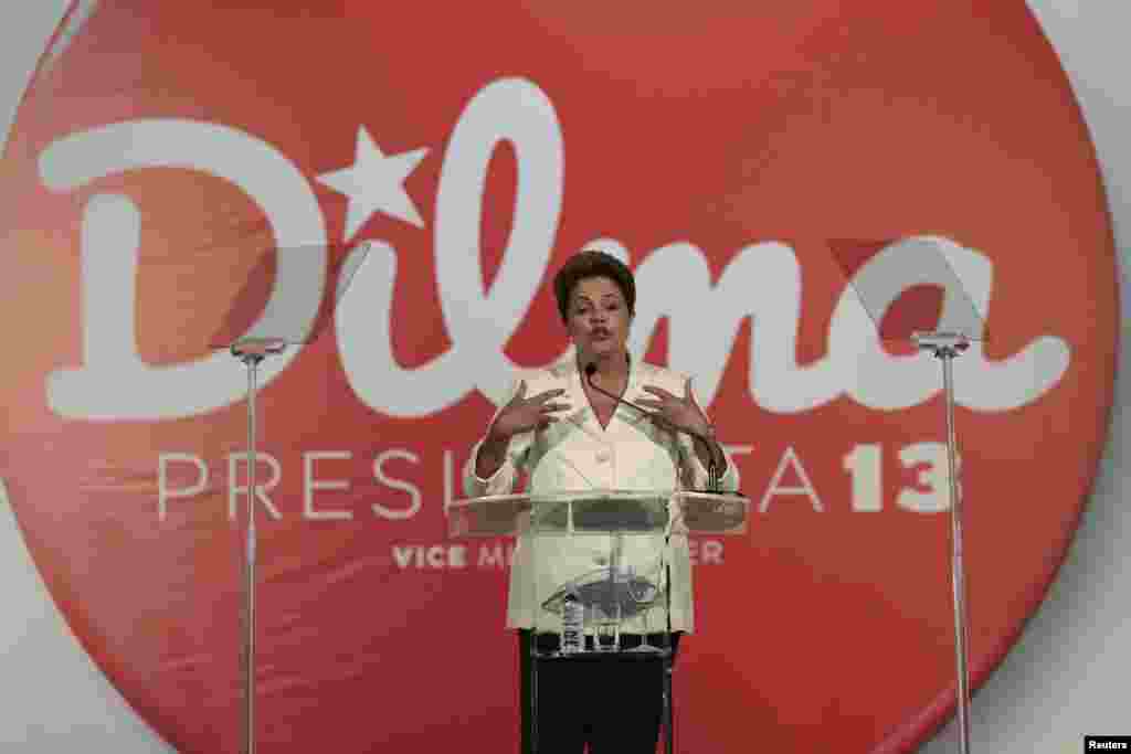 Brazil's President and Workers' Party (PT) presidential candidate Dilma Rousseff holds a news conference after voting in the first round of election in Brasilia, Oct. 5, 2014.