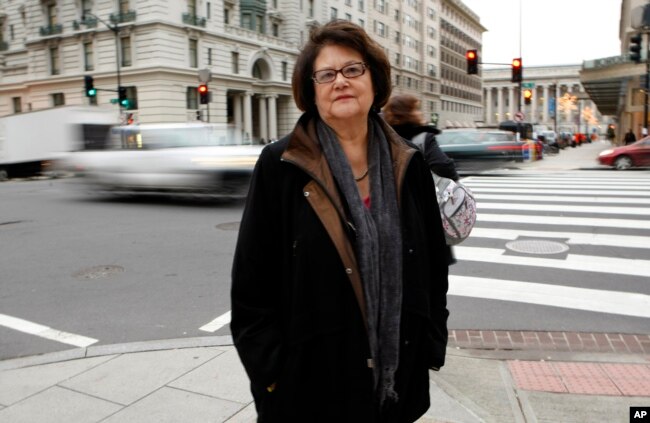 FILE - Elouise Cobell outside the law offices of Kilpatrick & Stockton on Dec. 8, 2009, in Washington. Cobell, known as “Yellow Bird Woman” (1945-2011), started the first bank established by a tribe on a reservation in Browning, Montana. (AP Photo/Gerald Herbert, File)