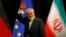 FILE - Iranian Foreign Minister Mohammad Javad Zarif waves after a plenary session at the United Nations building in Vienna.