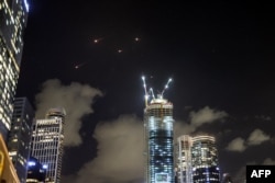 Projectiles are intercepted by Israeli defenses above Tel Aviv on Oct. 1, 2024.