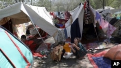 Internally displaced Afghans from northern provinces, who fled their home due to fighting between the Taliban and Afghan security personnel, take refuge in a public park Kabul, Afghanistan, Aug. 13, 2021.