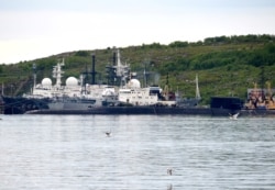 A picture taken July 2, 2019, shows an unidentified submarine in the port of Severomorsk, in Russia.