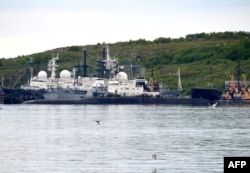A picture taken July 2, 2019, shows an unidentified submarine in the port of Severomorsk, in Russia.