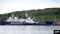 A picture taken July 2, 2019, shows an unidentified submarine in the port of Severomorsk, in Russia.