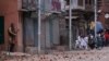 FILE - Demonstrators throw stones towards Indian police during clashes after the Eid al-Fitr prayers in Srinagar, India, June 5, 2019. 