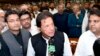 FILE - In this photo released by the National Assembly, the leader of Pakistan Tahreek-e-Insaf party Imran Khan,speaks at the National Assembly in Islamabad, Pakistan, Aug. 17, 2018. 