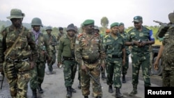 FILE: Lieutenant General Marcel Mashita Mbangu of the Armed Forces of the Democratic Republic of the Congo (center). Taken Feb. 9, 2023.