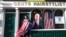 FILE - Catherine Hallahan waits for the celebrations to start in Ballina, North West of Ireland, Nov. 7, 2020. Ballina is the ancestral home of U.S. presidential candidate Joe Biden.