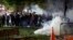 Tear gas billows as demonstrators gather in Lafayette Park to protest the death of George Floyd, May 31, 2020, near the White House in Washington.