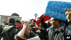 People celebrate after a Tunisian court dissolved the party of ousted President Zine El Abidine Ben Ali in a popular revolt, Tunis, March 9, 2011