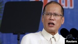 President Benigno Aquino reads his speech through a teleprompter during a graduation ceremony of police cadets at the Philippine National Police academy in Silang, Cavite south of Manila, March 26, 2015.