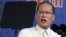 President Benigno Aquino reads his speech through a teleprompter during a graduation ceremony of police cadets at the Philippine National Police academy in Silang, Cavite south of Manila, March 26, 2015.