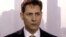 FILE -Image made from a video on March 28, 2018 shows Michael Kovrig, an adviser with the International Crisis Group, a Brussels-based non-governmental organization, speaking during an interview in Hong Kong. 
