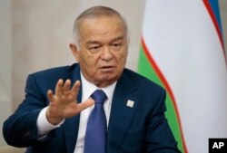 FILE - Uzbekistan's then-President Islam Karimov attends a summit in Ufa, Russia, July 10, 2015.