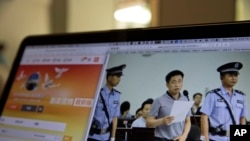 A photo described as the trial showing human rights lawyer Xie Yang which is seen on the social media of the Changsha Intermediate People's Court is shown on a computer in Beijing, May 8, 2017.