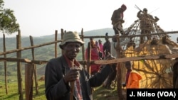 Evicted people build a house outside the protected Maasai Mau Forest in Kenya. Settlers in the forest say they paid for what they thought were legal titles to the land, but in many cases they were phony documents.