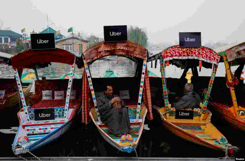 Uber signs are displayed on &quot;Shikaras&quot; or small boats after Uber launched its first water transport service on the waters of Dal Lake, one of Kashmir&#39;s main tourist attractions, in Srinagar, India.