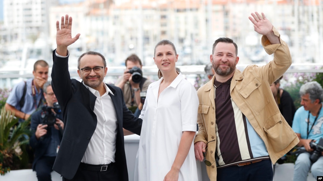 From left, director Andrey Zvyagintsev, actors Maryana Spikav and Alexei Rozin pose for photographers during the photo call for the film Loveless at the 70th international film festival, Cannes, southern France, Thursday, May 18, 2017. 