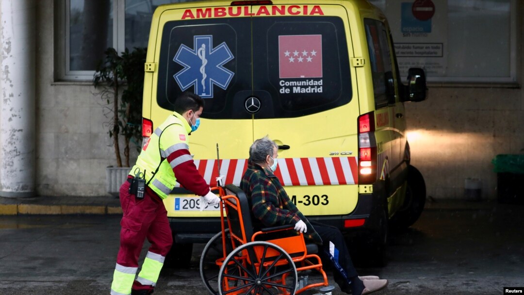 An ambulance worker arrives with a patient at the 12 de Octubre Hospital, amid the coronavirus disease (COVID-19) outbreak, in Madrid, Spain, March 31, 2020.