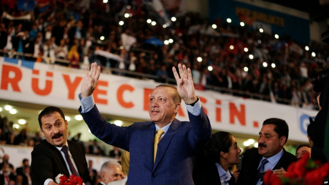 Turkey's President Recep Tayyip Erdogan waves to supporters as he arrives for a congress of the ruling Justice and Development Party (AKP) in Ankara, Turkey, May 21, 2017.