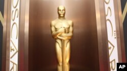 FILE - An Oscar statue is on display in Los Angeles, March 2, 2104. 