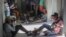 Journalists sit wounded after being shot by armed gangs at the General Hospital in Port-au-Prince, Haiti, Dec. 24, 2024.