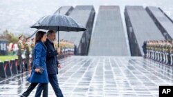 Armenian Prime Minister Nikol Pashinian and his wife Anna Akobian arrive at the monument to the victims of mass killings by Ottoman Turks, to commemorate the 105th anniversary of the massacre in Yerevan, April 24, 2020.