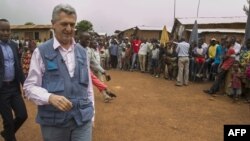 FILE: UN's high commissioner for refugees Filippo Grandi walks on April 8,2018 in the center of Gihembe refugee camp, Byumba, northern Rwanda, which has housed over 12,000 DRC refugees since 1997. 