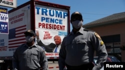 Pennsylvania State Police officers wearing protective face masks are pictured ahead of U.S. President Donald Trump campaign stop in Old Forge, Pennsylvania, August 20, 2020.