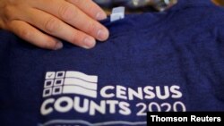 FILE - T-shirts are displayed at a community activists and local government leaders event to mark the one-year-out launch of the 2020 Census efforts in Boston.