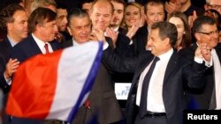FILE - Nicolas Sarkozy, candidate for the French center-right presidential primary, attends a c.ampaign rally in Nimes, southern France, Nov. 18, 2016