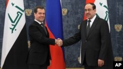 Premijer Rusije Dmitrij Medvedev (levo) i njegov irački kolega Nuri al-Maliki pre sureta u rezidenciji Gorki, prošlog meseca
