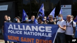 Unionists police officers gather outside an official building in Bobigny, outside Paris, France, June 22, 2020. 