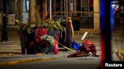 Chairs are left abandoned after a car plowed through a holiday parade in Waukesha, Wisconsin, Nov. 22, 2021. 