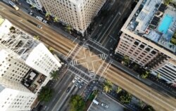 An aerial view shows the intersection of Hollywood and Vine, shortly before sunset, with lighter than normal traffic as the coronavirus pandemic continues on March 25, 2020 in Los Angeles, California.