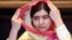 Nobel Peace Prize laureate Malala Yousafzai adjusts her scarf as she speaks during an interview with Reuters at a hotel in Islamabad, Pakistan, March 30, 2018. 