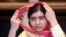 Nobel Peace Prize laureate Malala Yousafzai adjusts her scarf as she speaks during an interview with Reuters at a local hotel in Islamabad, Pakistan, March 30, 2018. 
