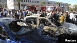 A view shows the wreckage after a car bomb exploded in the Syrian capital Damascus September 7, 2012