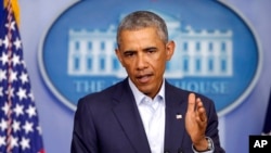 President Barack Obama speaks in the James Brady Press Briefing Room of the White House in Washington, Aug. 18, 2014.