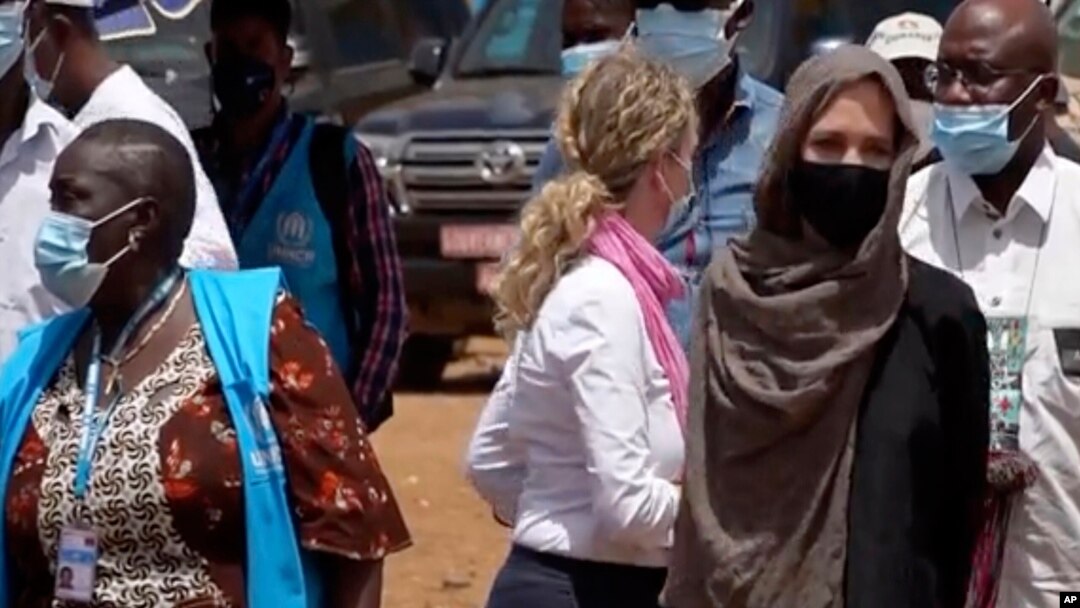 United Nations High Commissioner for Refugees Angelie Jolie, right, visits the Malian refugee camp in Goudebo, Burkina Faso, June 20, 2021, to mark World Refugee day.