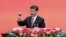 FILE - Chinese President Xi Jinping offers a toast after delivering a speech during a reception to mark the 70th anniversary of Japan's surrender during World War II in Beijing.