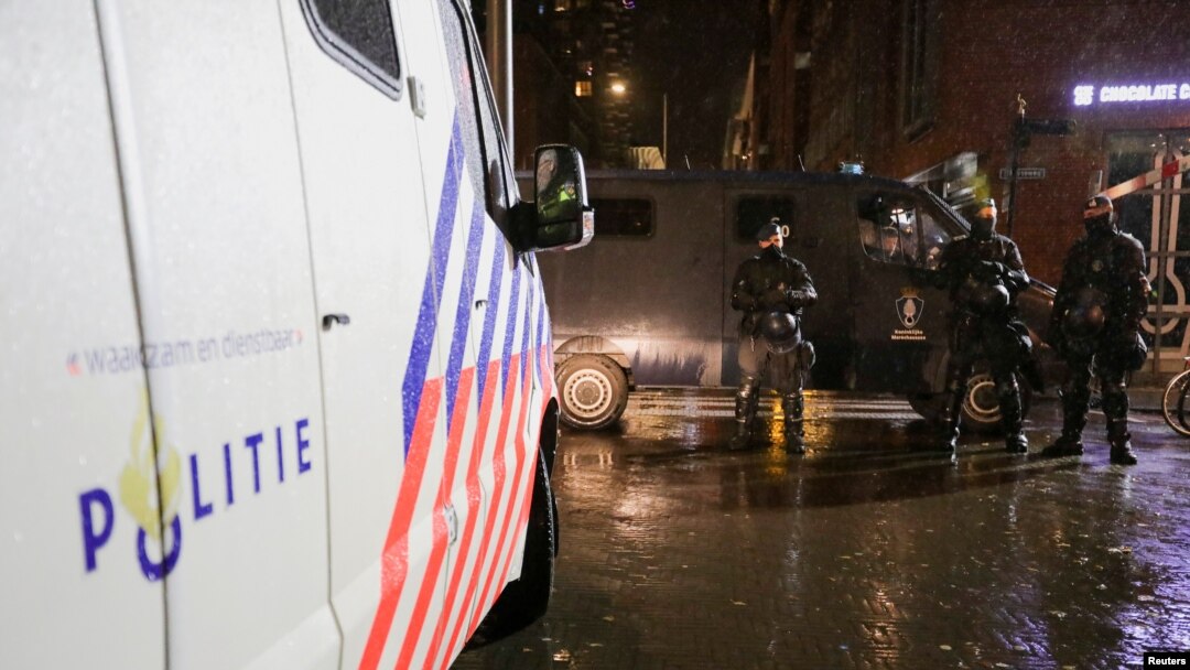 Police officers stand guard following Dutch Prime Minister Mark Rutte's announcement of new measures to fight a record surge in coronavirus disease (COVID-19) infections, in The Hague, Netherlands, Nov. 26, 2021.